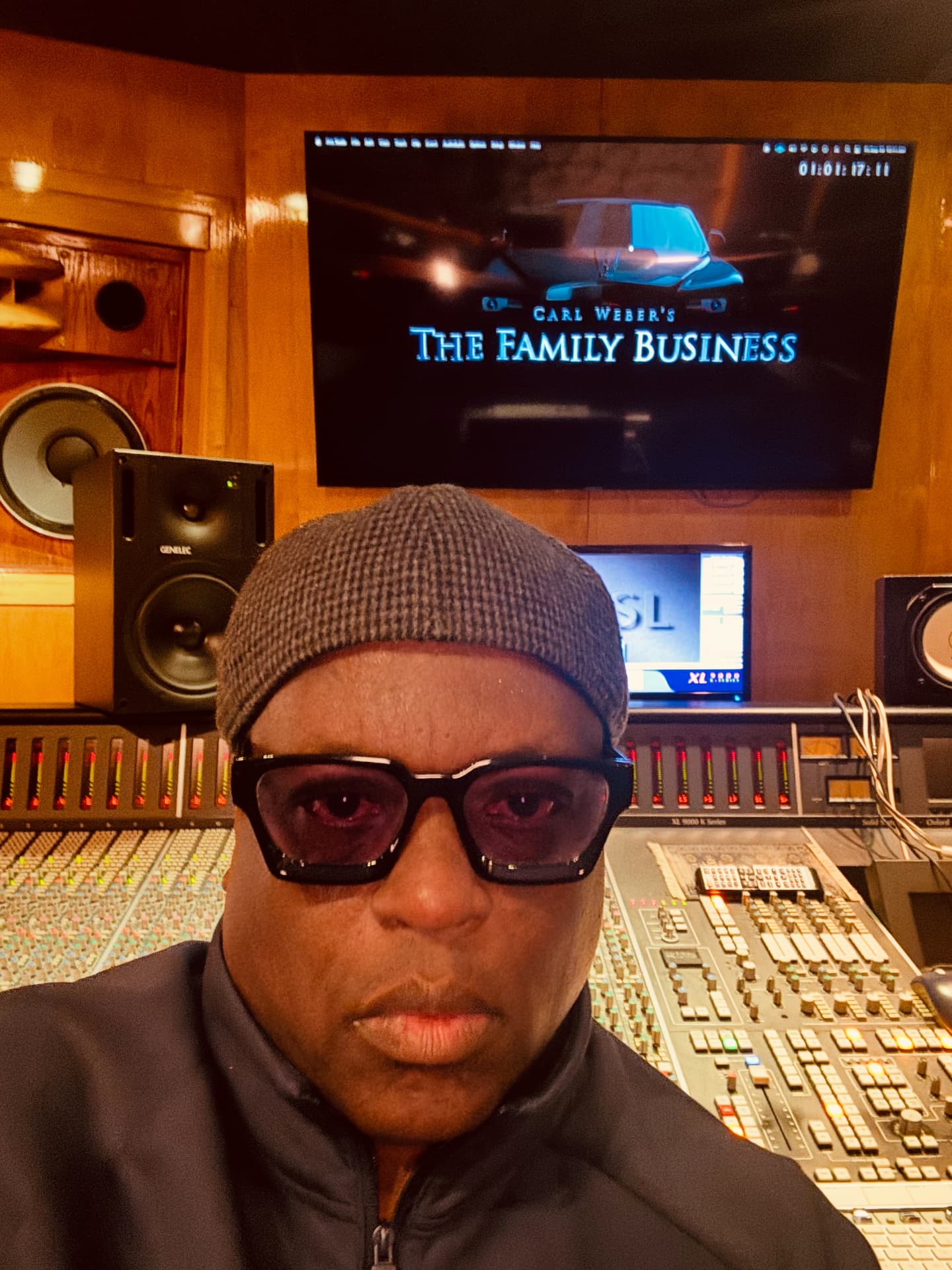 Rob Diggy Morrison in the studio with Carl Weber's The Family Business on screen