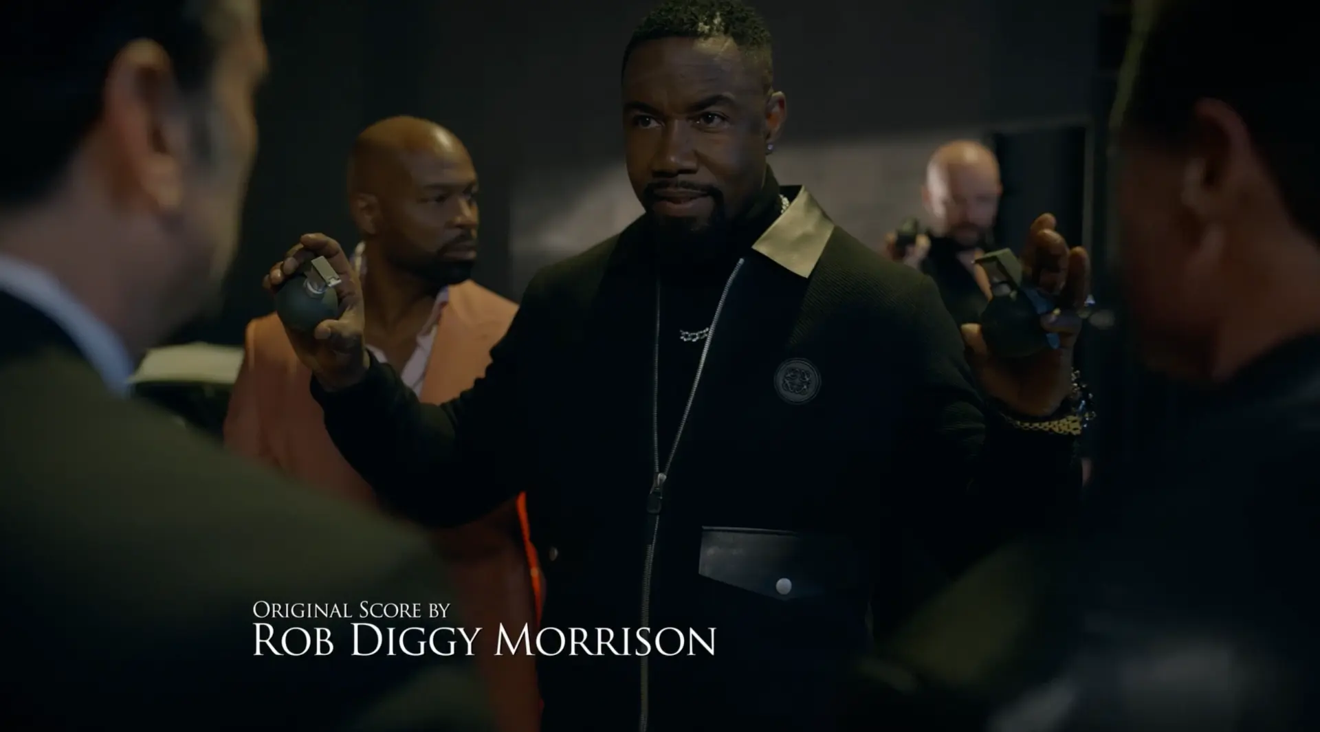 Original score by Rob Diggy Morrison end card over an action standoff scene
